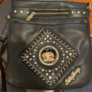 Betty Boop black leather crossbody purse with a rhinestone and chain design